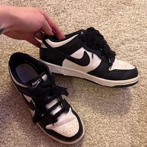 Nike Black & White panda Low-Top with black lace show strings.